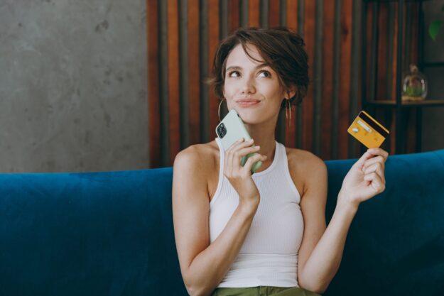 woman money shutterstock_2254453457