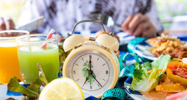 clock and food shutterstock_2365739577